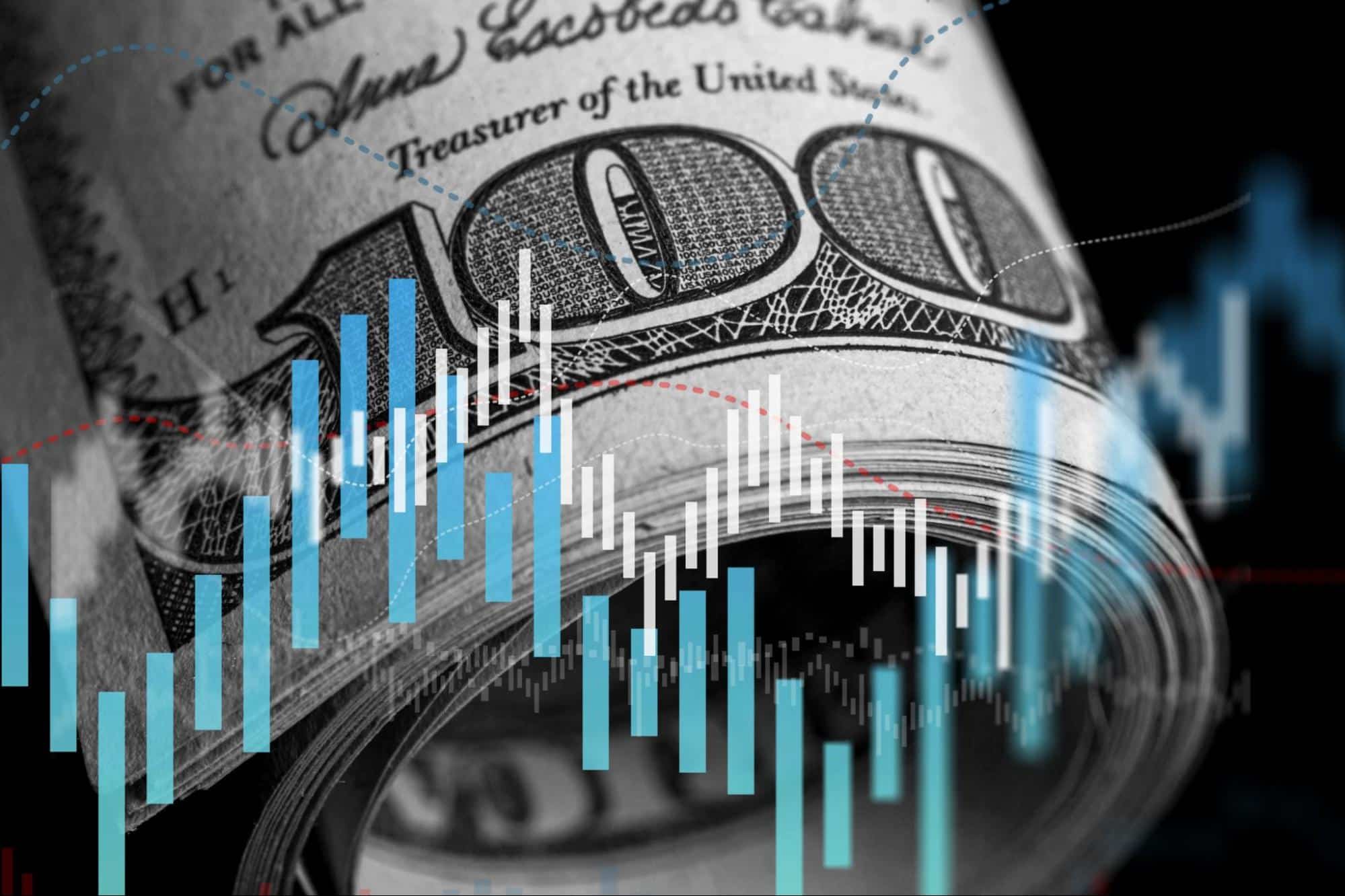 Nota de cem dólares com um gráfico econômico