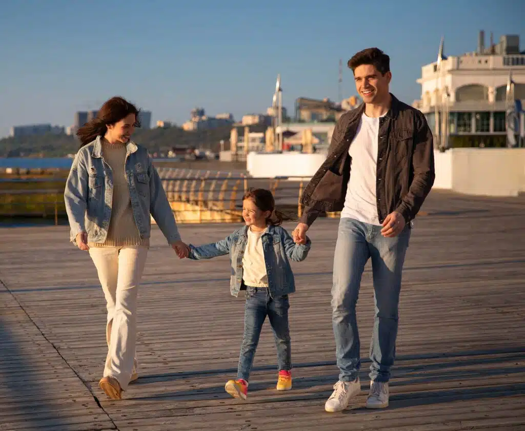 Family walking in port, sunny